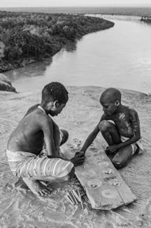 Bao board game above Ethiopia's Omo River