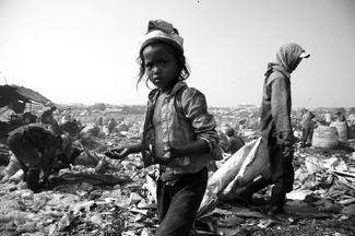 Little Girl Working in Rubbish